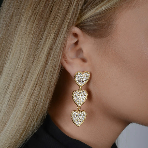 Woman wearing the Maeva Earrings - Shine with 3 heart dangle earrings by Margot Bardot Online